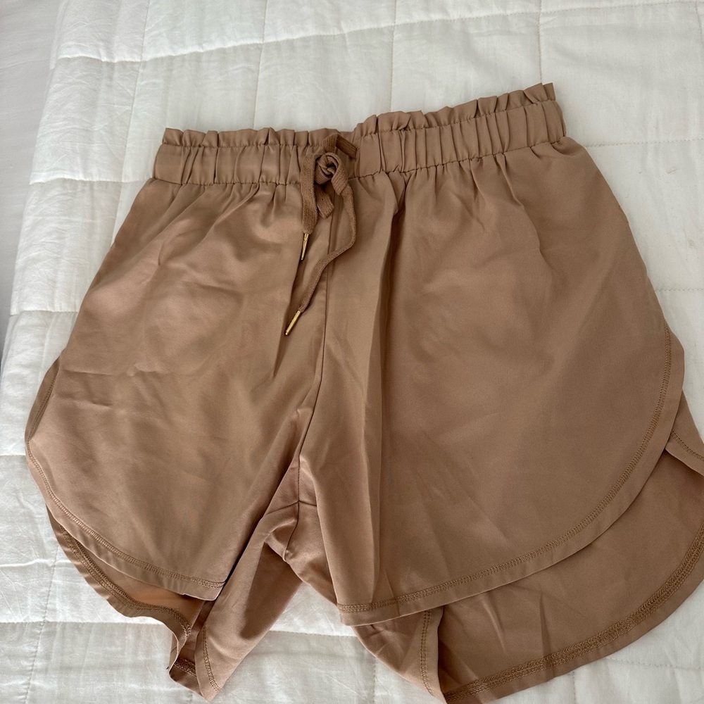 Gold Elite high waisted shorts. Tan size M